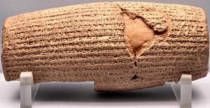 The Cyrus Cylinder, a barrel-shaped clay tablet with cuneiform inscription